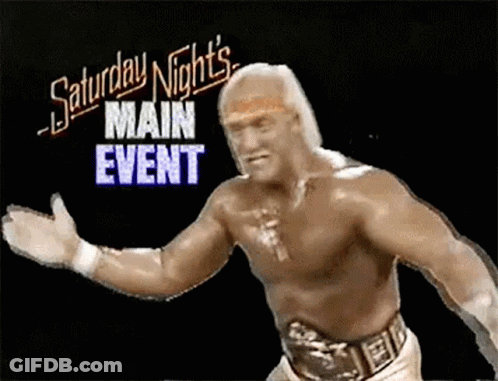 A Shirtless Wrestling Wrestler Is Standing In Front Of A Saturday Night 'S Main Event Sign . GIF