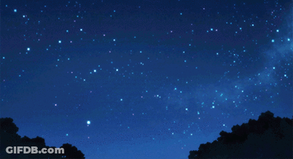 A Shooting Star Shines Brightly In A Dark Night Sky GIF