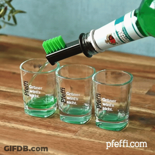 A Shot Glass With The Word Pfeffi On It GIF