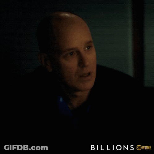 A Showtime Ad For Billions Features A Bald Man In A Dark Room GIF