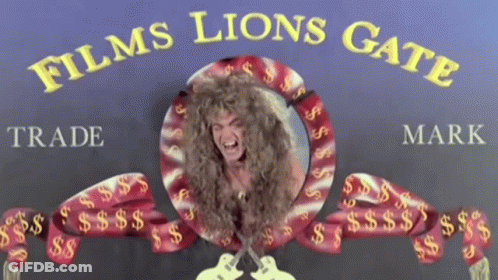 A Sign For Films Lions Gate With A Picture Of A Woman GIF