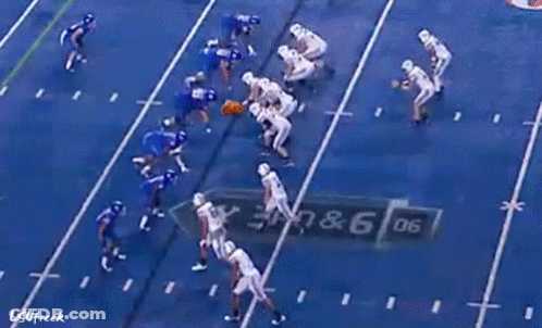 A Sign For Goldy 'S Breakfast Hangs Over A Football Field GIF