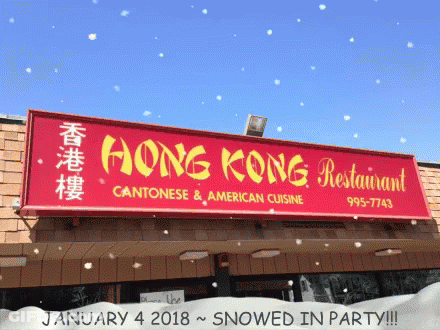 A Sign For The Hong Kong Restaurant Is Covered In Snow GIF