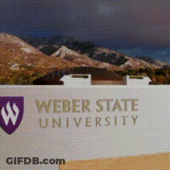 A Sign For Weber State University With A Picture Of Mountains Behind It GIF