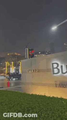 A Sign That Says ' Aifa Grand Boulevard ' In Arabic GIF