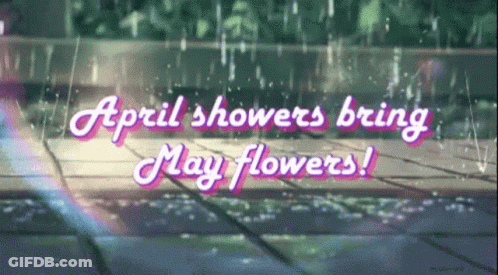 A Sign That Says April Showers Bring May Flowers On A Rainy Day GIF