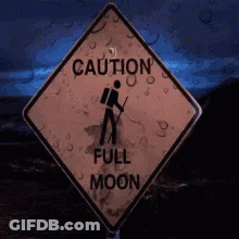 A Sign That Says Caution Full Moon With A Person Looking Through Binoculars GIF