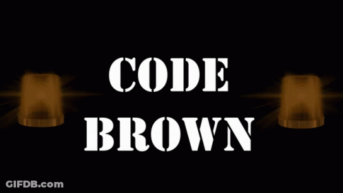 A Sign That Says " Code Brown " With Two Lights Behind It GIF