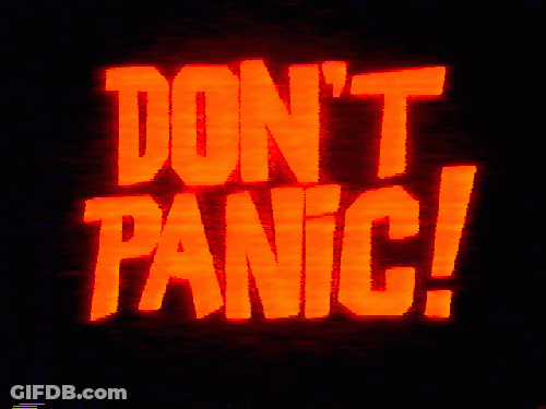 A Sign That Says " Do N't Panic " Is Lit Up In Red GIF