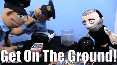 A Sign That Says Get On The Ground With Three Puppets On It GIF