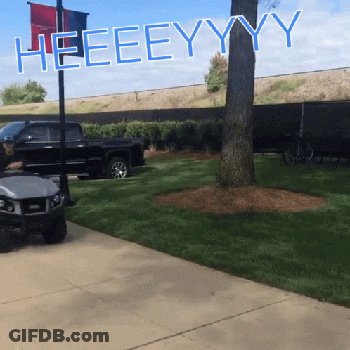 A Sign That Says Heeeeyyy Is On A Pole GIF