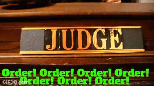 A Sign That Says Judge On It In Gold GIF