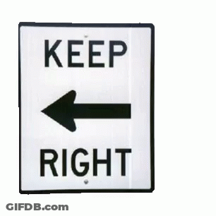 A Sign That Says Keep Right With An Arrow Pointing To The Left GIF