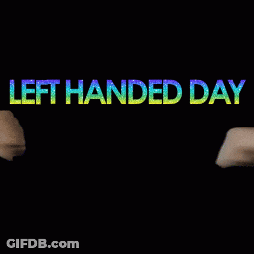 A Sign That Says Left Handed Day With Two Fists GIF