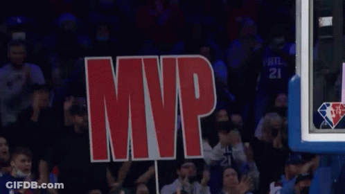 A Sign That Says Mvp Is Being Held Up By A Crowd Of People GIF