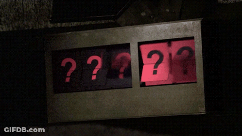 A Sign That Says ' ?? ' On It In Red GIF