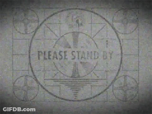 A Sign That Says Please Stand By Is On A Black And White Background GIF