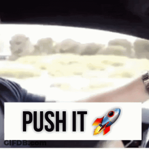 A Sign That Says Push It With A Rocket Icon GIF