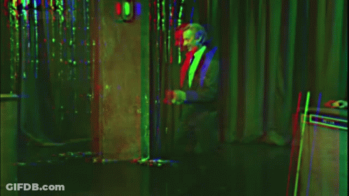 A Sign That Says " Remain Indoors " In White Letters GIF
