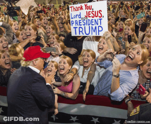 A Sign That Says Thank You Lord For Jesus President Trump Is Being Held By A Crowd Of People GIF