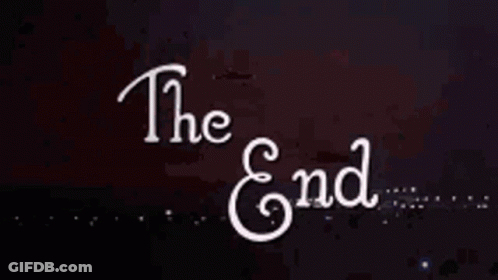 A Sign That Says The End With A Firework In The Background GIF