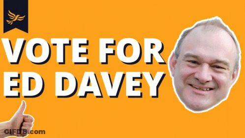 A Sign That Says Vote For Ed Davey With A Picture Of A Man Giving A Thumbs Up GIF