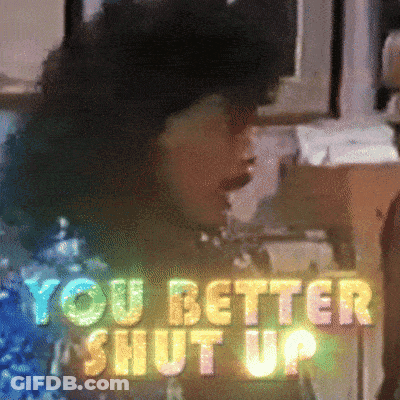 A Sign That Says " You Better Shut Up " With A Woman In The Background GIF