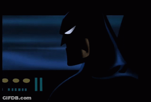 A Silhouette Of A Batman With A Blue Background GIF