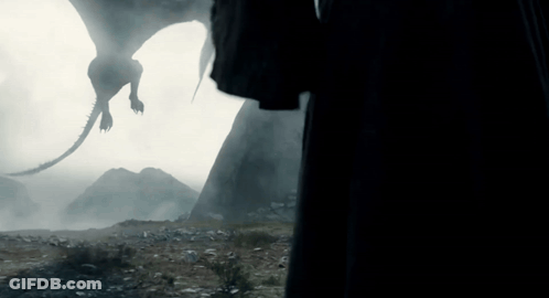A Silhouette Of A Dragon Flying In The Air GIF