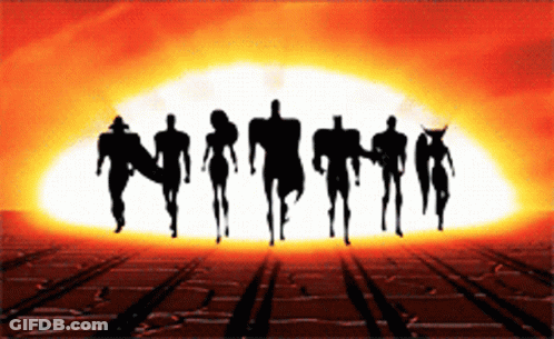 A Silhouette Of A Group Of People Standing In Front Of A Large Explosion GIF