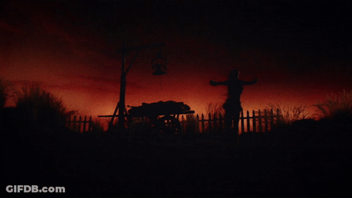 A Silhouette Of A Horse Drawn Carriage In The Dark GIF
