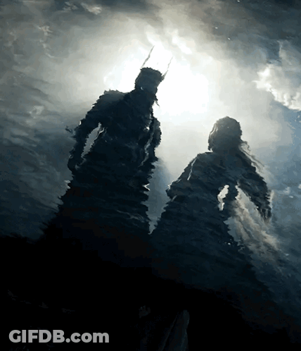 A Silhouette Of A Man And Woman In The Water GIF