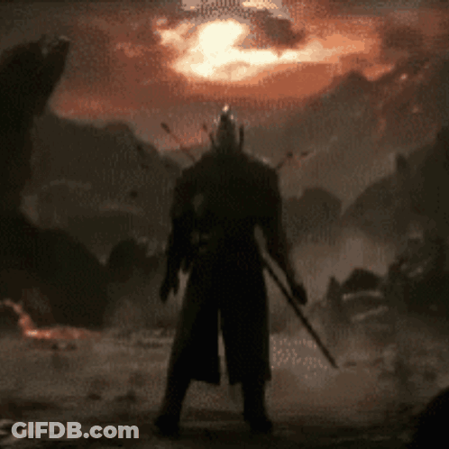 A Silhouette Of A Man Holding A Sword In Front Of Mountains GIF
