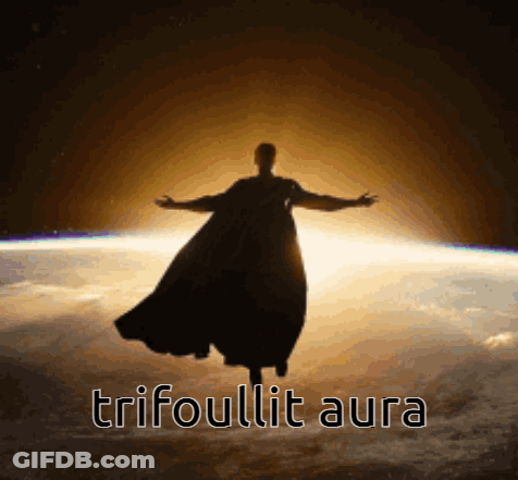 A Silhouette Of A Man In A Cape Flying Over The Earth With The Words Trifoulit Aura Below Him GIF