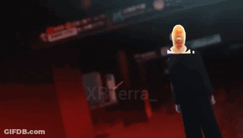 A Silhouette Of A Man In Front Of A Fire With The Word Xterra Visible GIF