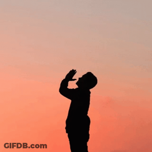 A Silhouette Of A Man Praying With The Words " Prayer Changes Things " Behind Him GIF