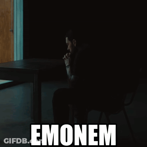 A Silhouette Of A Man Sitting At A Table With The Word Emonem Behind Him GIF