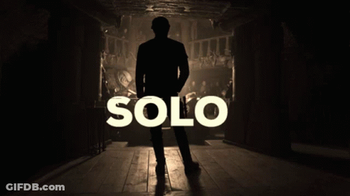 A Silhouette Of A Man Standing In A Dark Room With The Word Solo Behind Him GIF