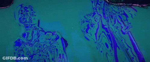 A Silhouette Of A Man Standing In Front Of A Microphone On A Red And Yellow Background . GIF