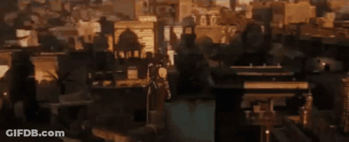 A Silhouette Of A Man Standing In Front Of A Sunset . GIF