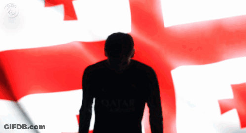 A Silhouette Of A Man Wearing A Qatar Shirt GIF