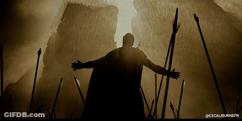 A Silhouette Of A Man With His Arms Outstretched And The Words Excaliburnefr Below GIF