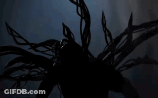 A Silhouette Of A Person In A Dark Room GIF