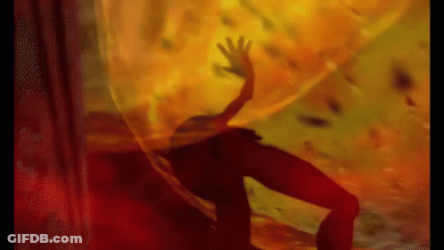 A Silhouette Of A Person Is Behind A Curtain With A Hand Reaching Out GIF
