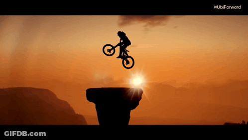 A Silhouette Of A Person On A Bike Jumping Over A Cliff With The Ubi Forward Logo In The Background GIF