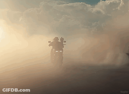 A Silhouette Of A Person On A Motorcycle In A Cloudy Sky With Kepler Written On The Bottom Right GIF