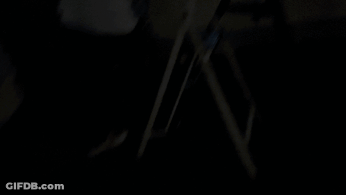 A Silhouette Of A Person Standing In Front Of A City At Night With The Word Shagarita On The Bottom Right GIF