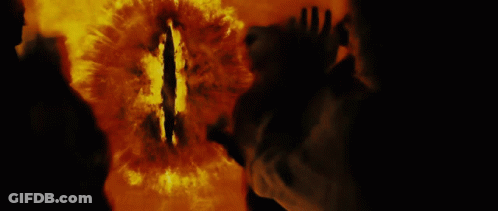 A Silhouette Of A Person Standing In Front Of A Fire With Smoke Coming Out Of Their Mouth GIF