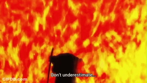 A Silhouette Of A Person Standing In Front Of A Fire With The Words `` Don 'T Underestimate ... '' . GIF