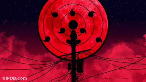 A Silhouette Of A Person Standing In Front Of A Full Moon GIF